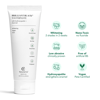 Brilliant Black toothpaste tube with hydroxyapatite, whitening and vegan feature icons