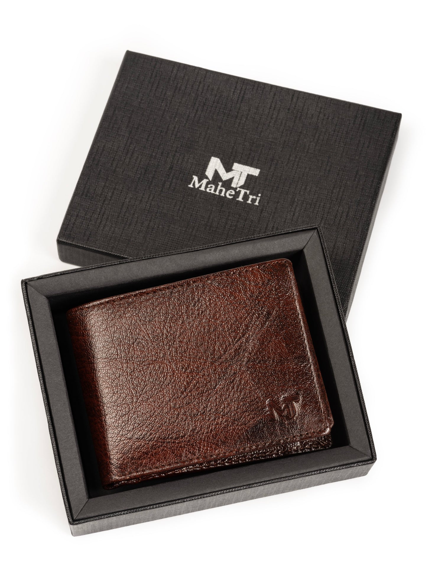 Brown leather bi-fold wallet in a gift box, front logo panel visible.