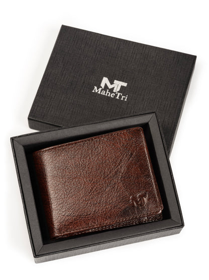 Brown leather bi-fold wallet in a gift box, front logo panel visible.