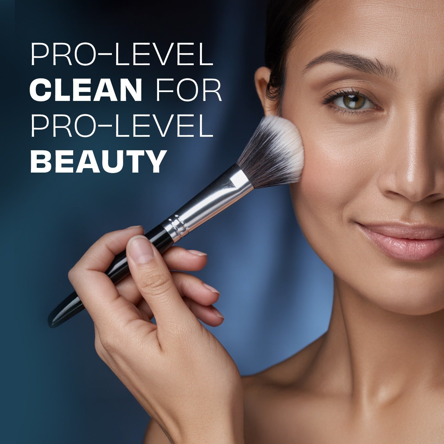 Makeup brush held by hand near face for brush cleaning