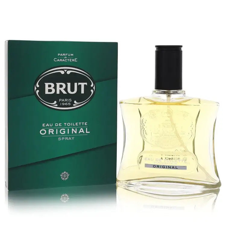 Men's cologne bottle with black cap and clear yellow liquid beside dark green box
