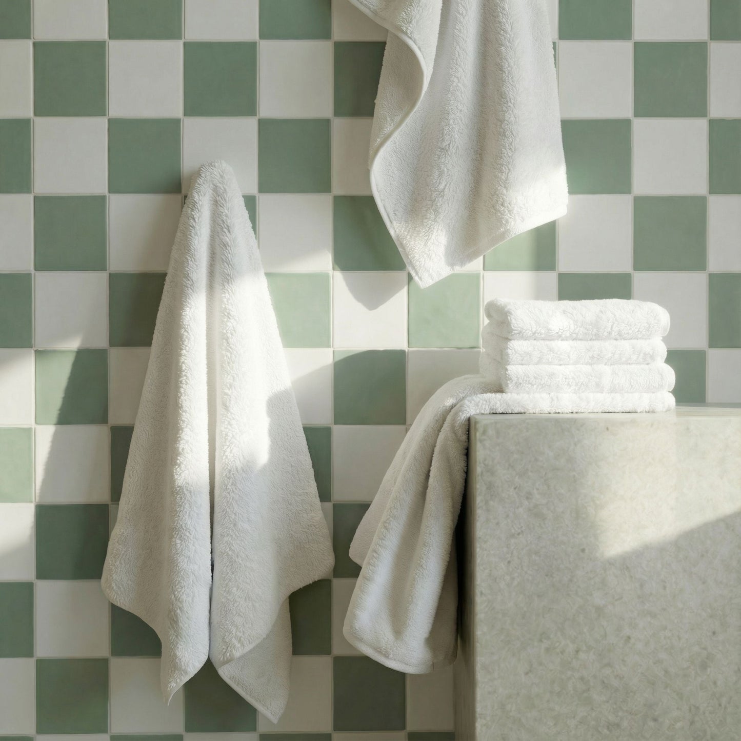 White cotton towels set, hanging and folded plush terry towels