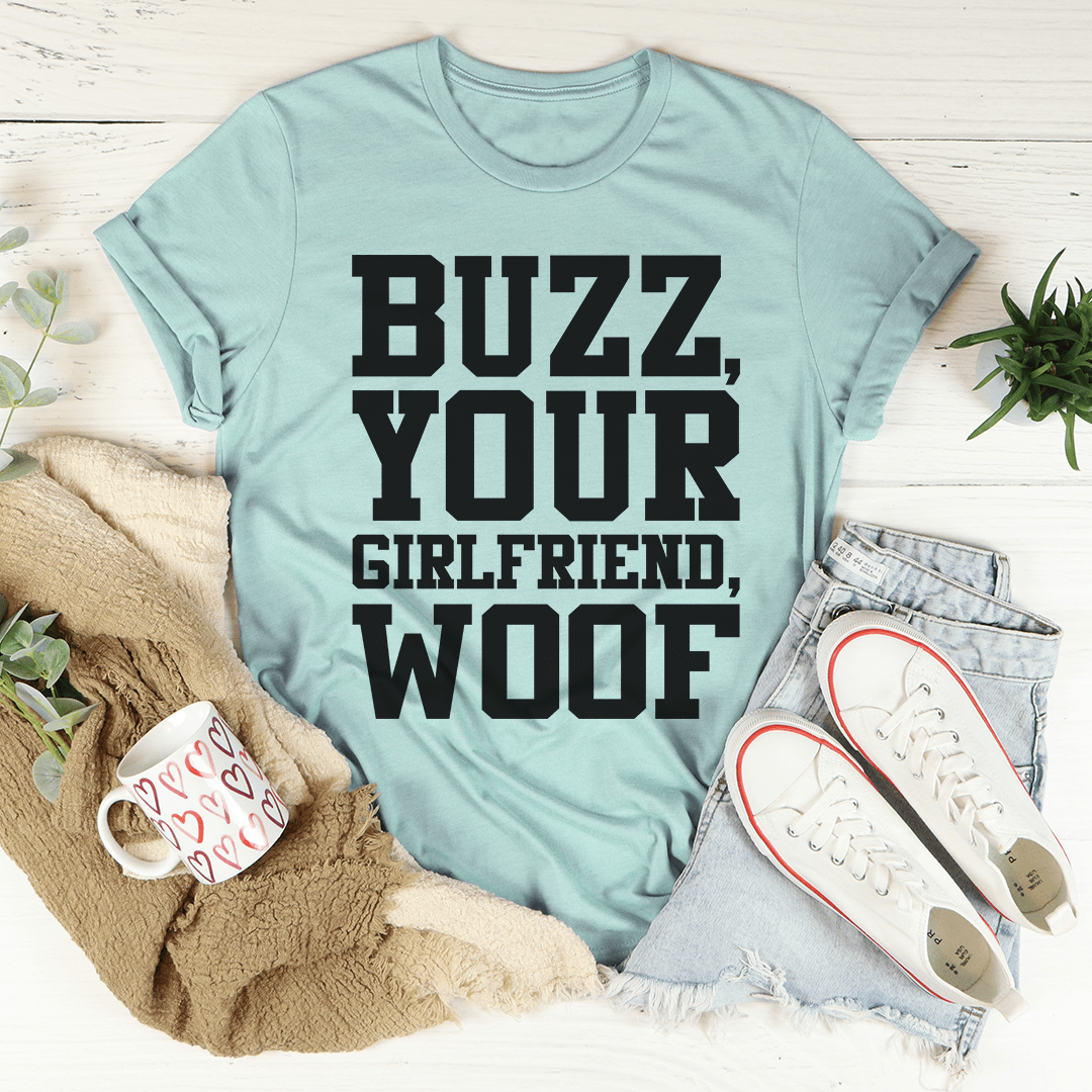 Light blue t-shirt with bold front graphic text: "BUZZ, YOUR GIRLFRIEND, WOOF"