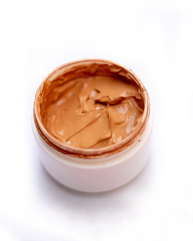 Custom blend foundation jar top view with smooth caramel cream surface