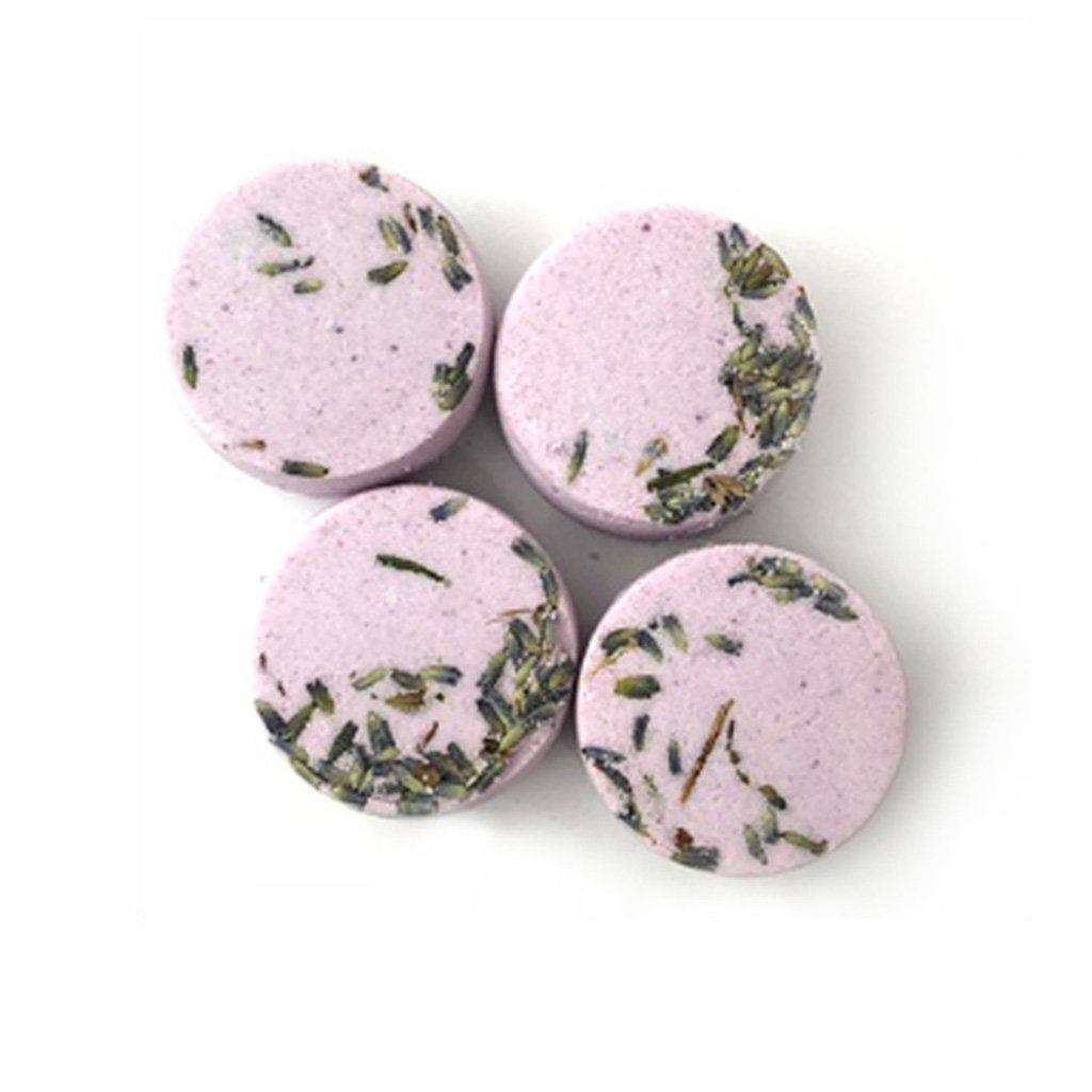 Four lavender geranium shower steamers, pale purple rounds with herb specks