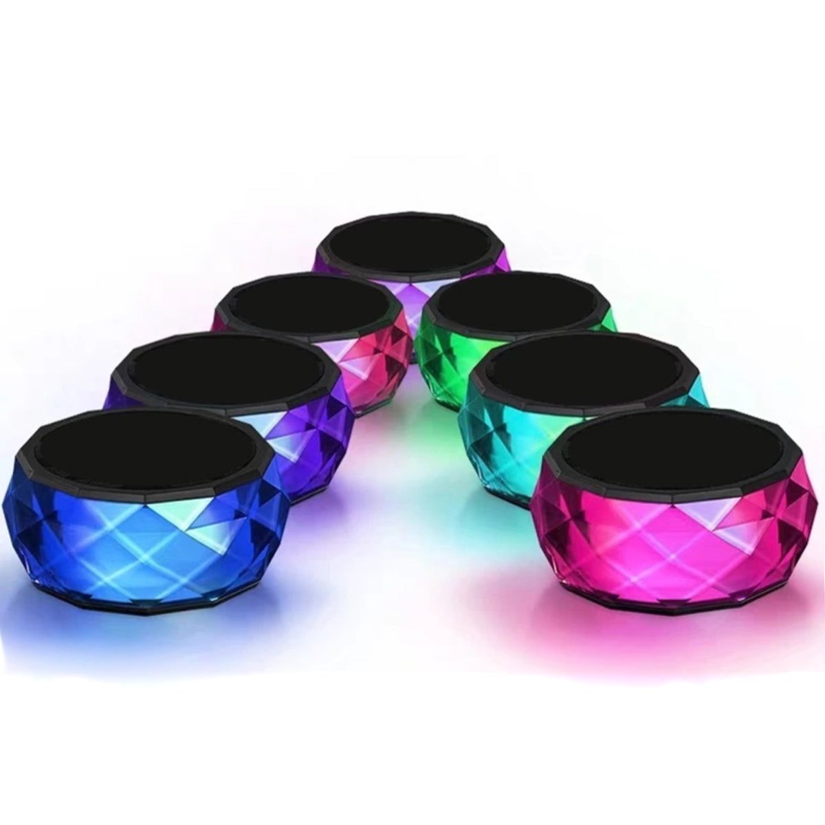 Six mini LED Bluetooth speakers with multicolor faceted bodies and black top grilles