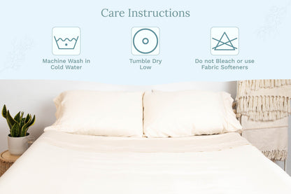 White sateen pillowcases on a bed, smooth fabric with envelope closure.