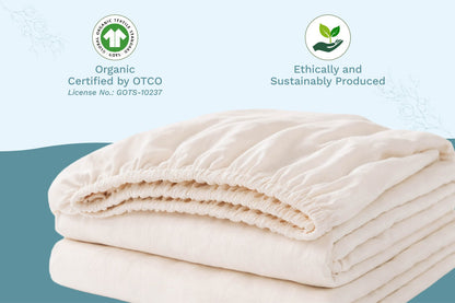 Natural cotton baby crib sheets, folded stack of fitted sheets