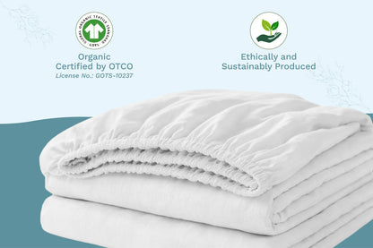 Natural cotton baby crib sheets, folded stack of fitted sheets