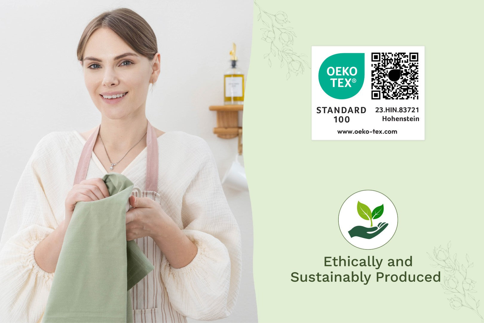 Sage green flour sack kitchen towel, folded and held
