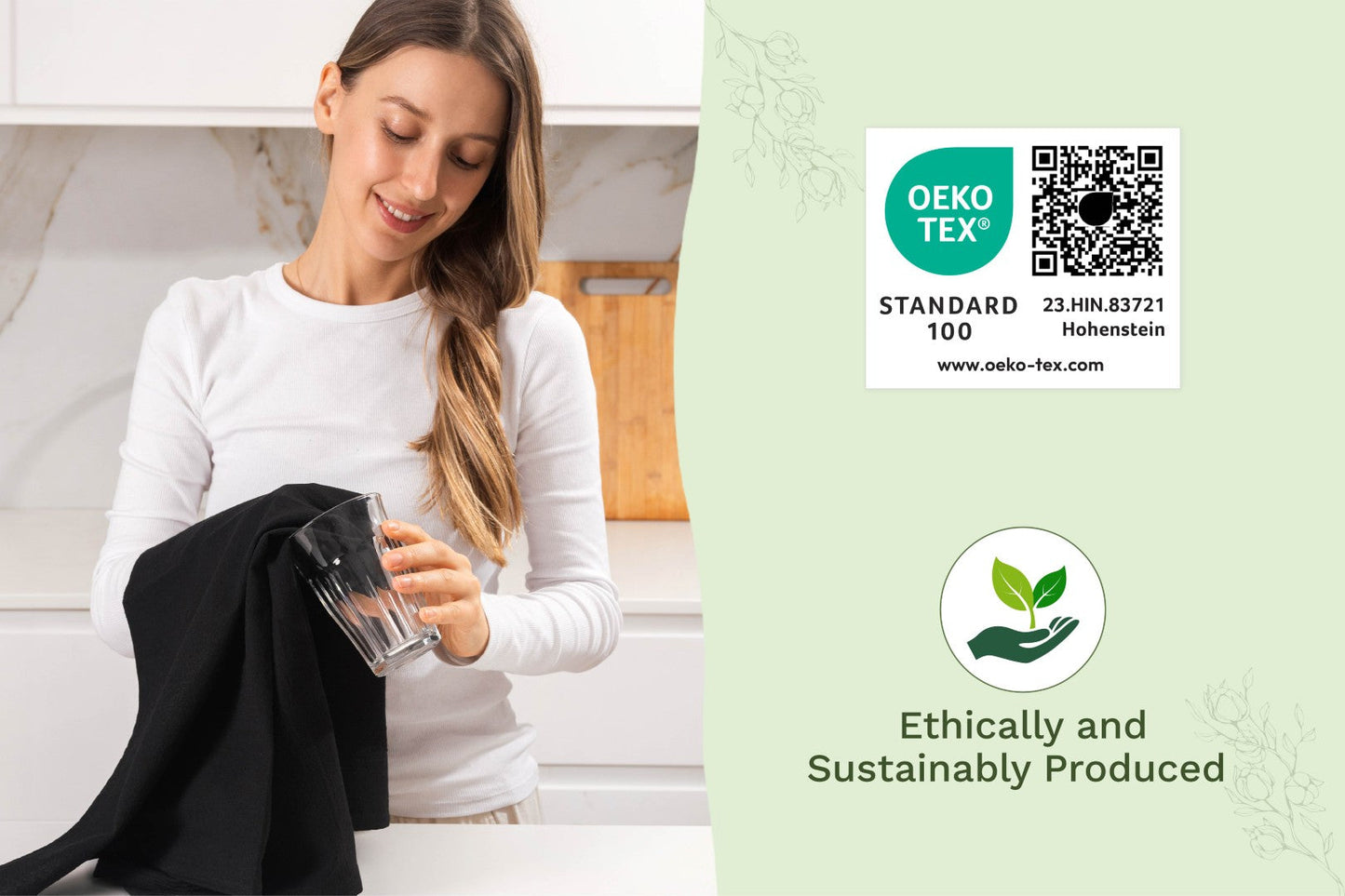 Black flour sack kitchen towel held by person, ready for use