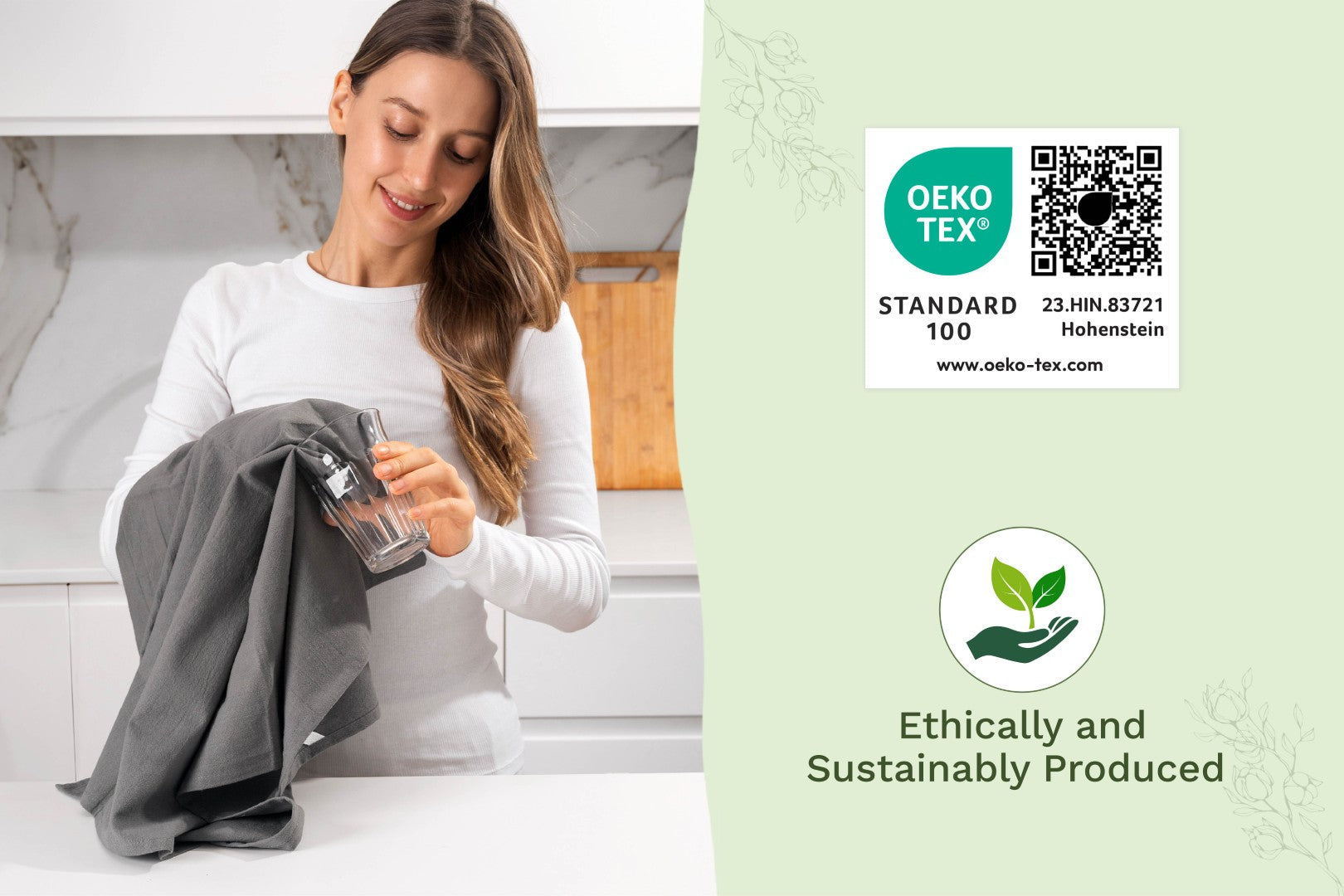 Gray flour sack kitchen towel held by a person in a home kitchen