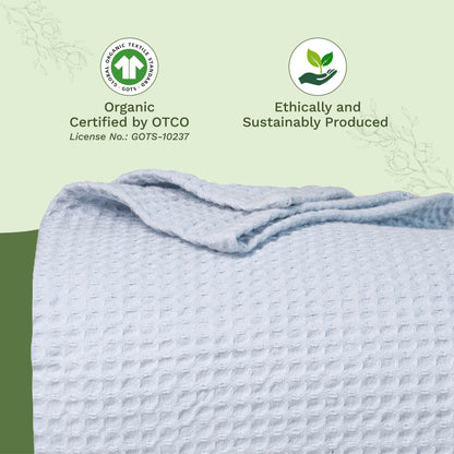 Waffle weave blanket, light blue folded with textured grid surface