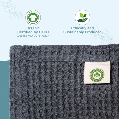 Gray waffle-weave blanket corner with stitched fabric tag