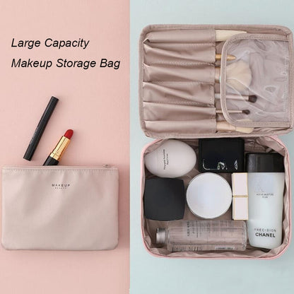 Pink cosmetic storage bag open with multiple interior pockets and zip sections