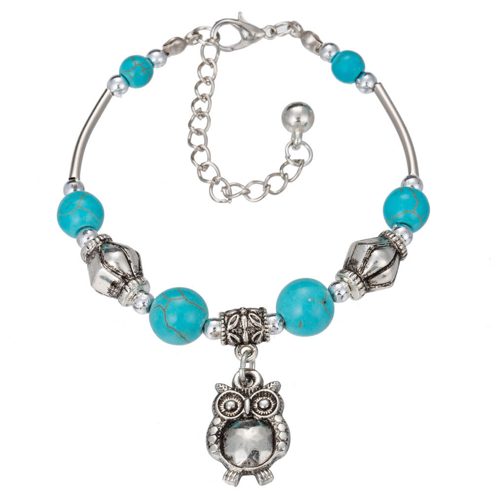 Silver-tone turquoise bead bracelet with owl charm and dangling center piece