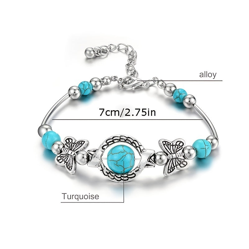 Silver-tone turquoise butterfly charm bracelet with central round cabochon