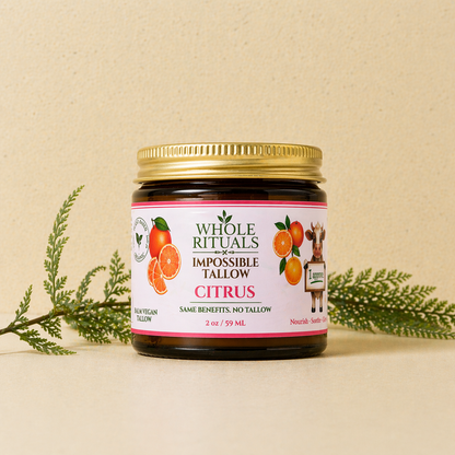 Moisturizing balm jar with gold lid and citrus label on beige background