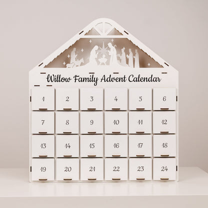 White advent calendar with 24 numbered drawers and nativity scene on front