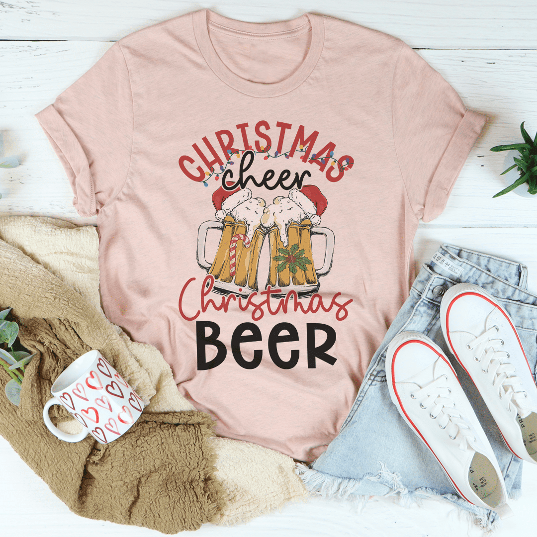 Pink Christmas beer graphic tee with “Cheer” text and beer mugs front print