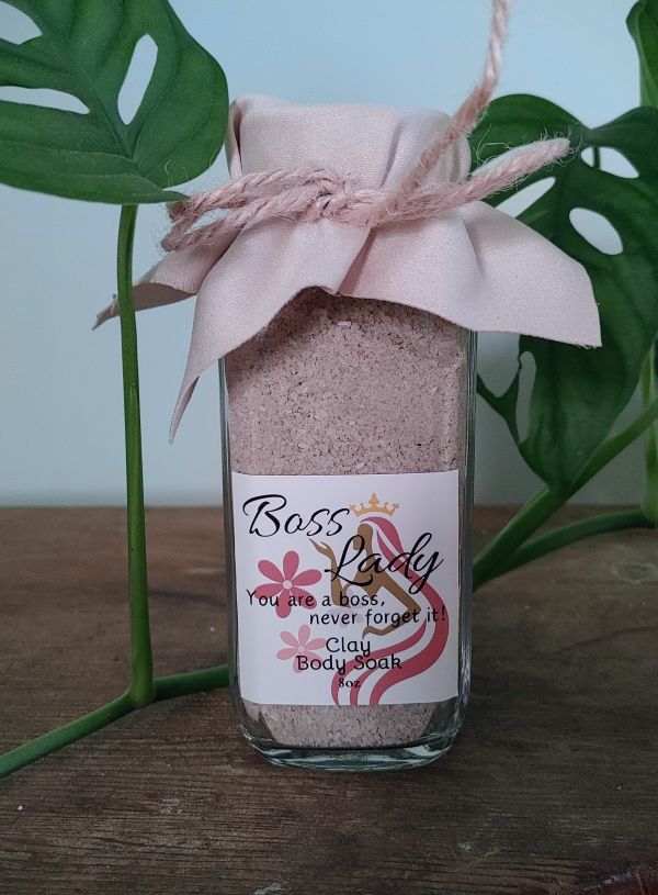 Clay body soak bottle labeled Boss Lady, pink powder inside