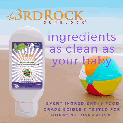Infant sunscreen bottle with purple label and sunblock graphic.