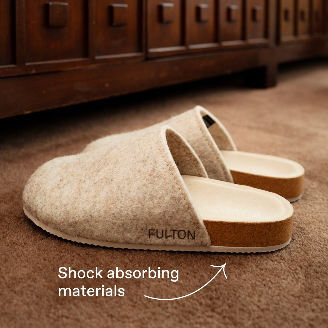 Beige house shoe pair with tan lining and cushioned slip-on sole