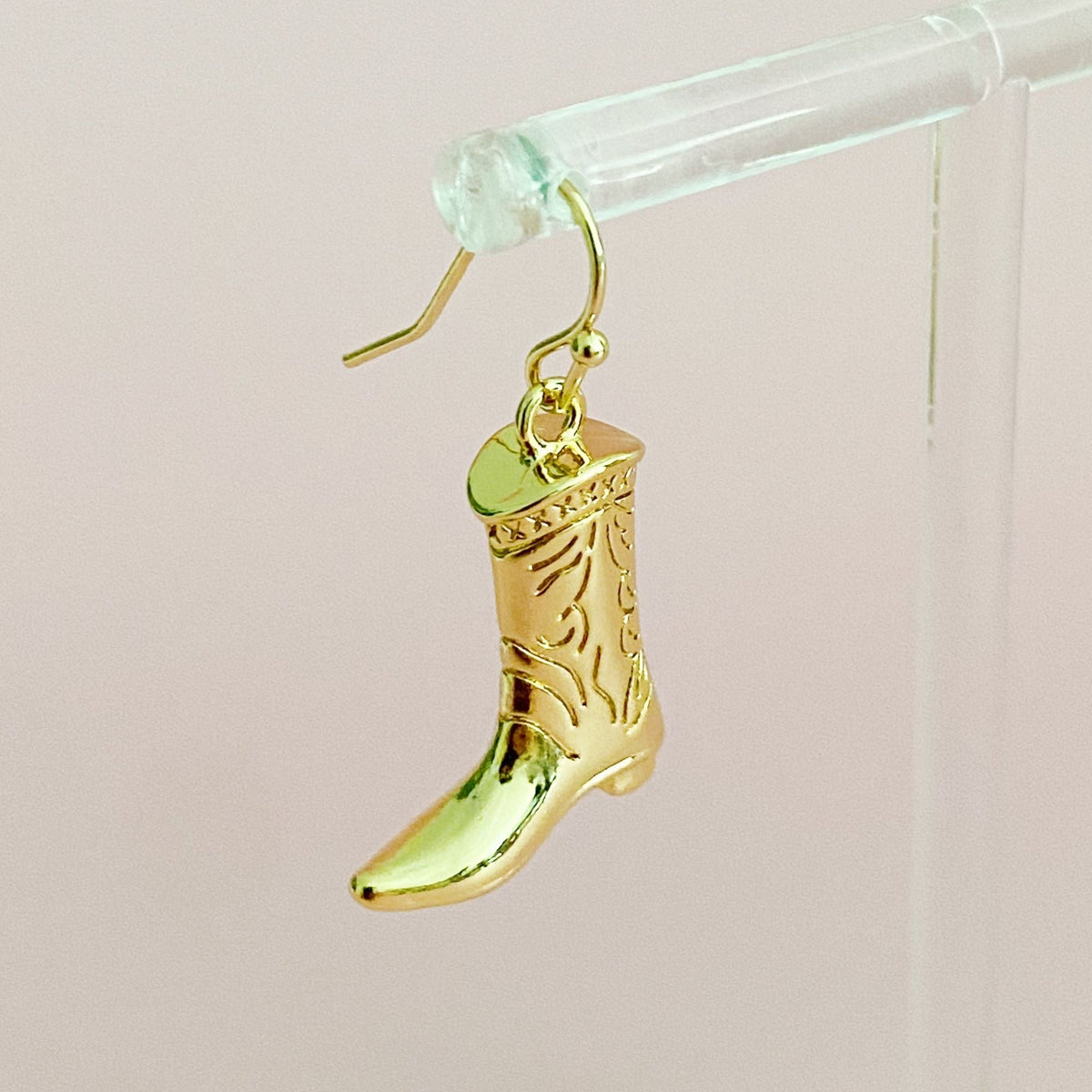 Gold-tone cowgirl boot dangle earring with hook closure