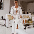 Long white crochet cover-up dress with deep V neckline and lace sleeves