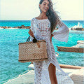 White crochet beach cover-up dress with V-neck and lace trim.