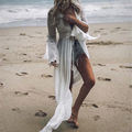White crochet beach cover-up dress with V-neck and sheer lace sleeves.