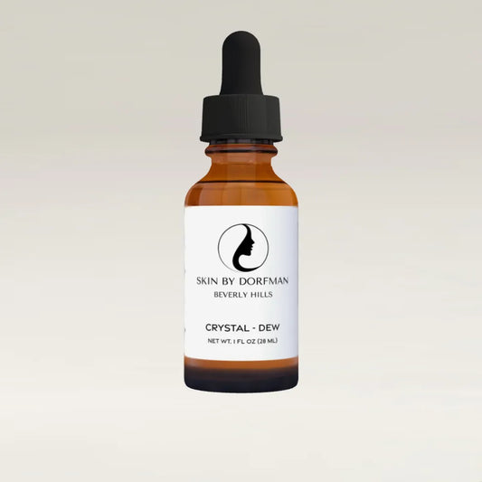 Hydrating serum bottle in amber glass with black dropper