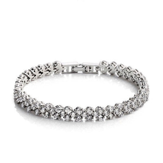 Silver tennis bracelet with row of round CZ stones and hinged center links.