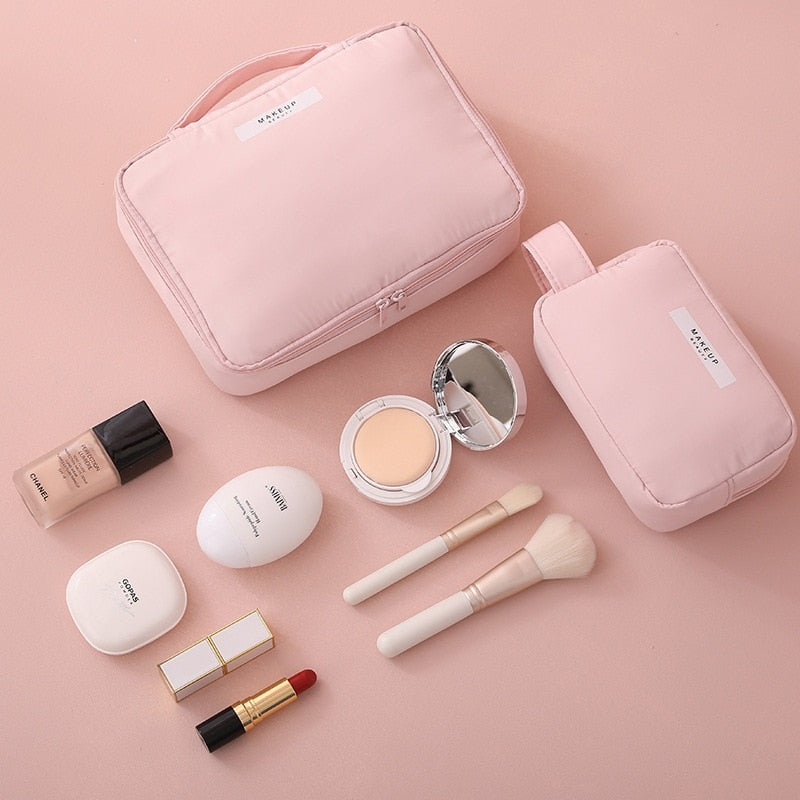 Pink cosmetic bag set with two zip pouches and matching cosmetic organizer