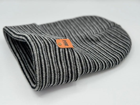 Cuffed knit beanie in black and gray with vertical stripe texture