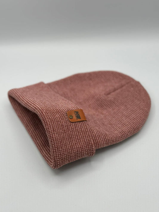 Dark pink-burgundy knit beanie with fold-over cuff and brown logo label