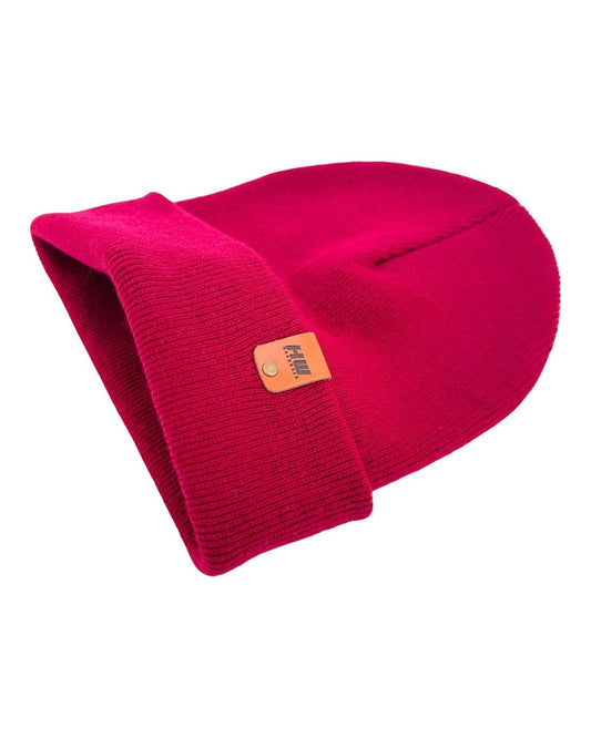 Maroon ribbed knit beanie with folded cuff and side logo patch, angled view