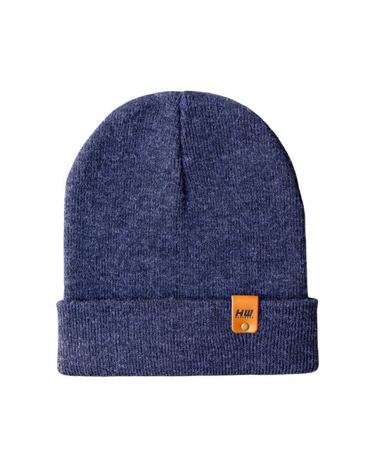 Cuffed knit beanie in solid denim blue with brown logo patch on the cuff