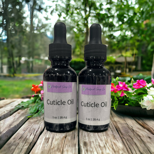 Cuticle oil bottles, two dark glass with black droppers and 'Cuticle Oil' labels