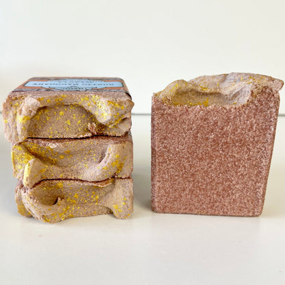Sea salt soap bars: stacked bars and one unwrapped bar in rustic mahogany with speckling