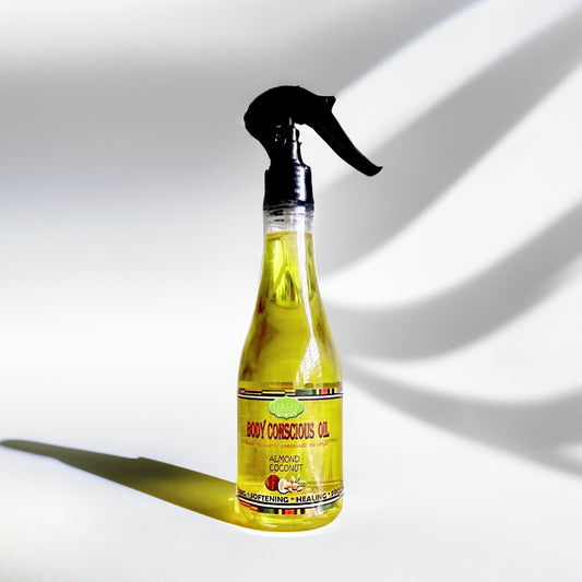 Lightweight body oil spray bottle with almond coconut label, clear amber oil in bottle