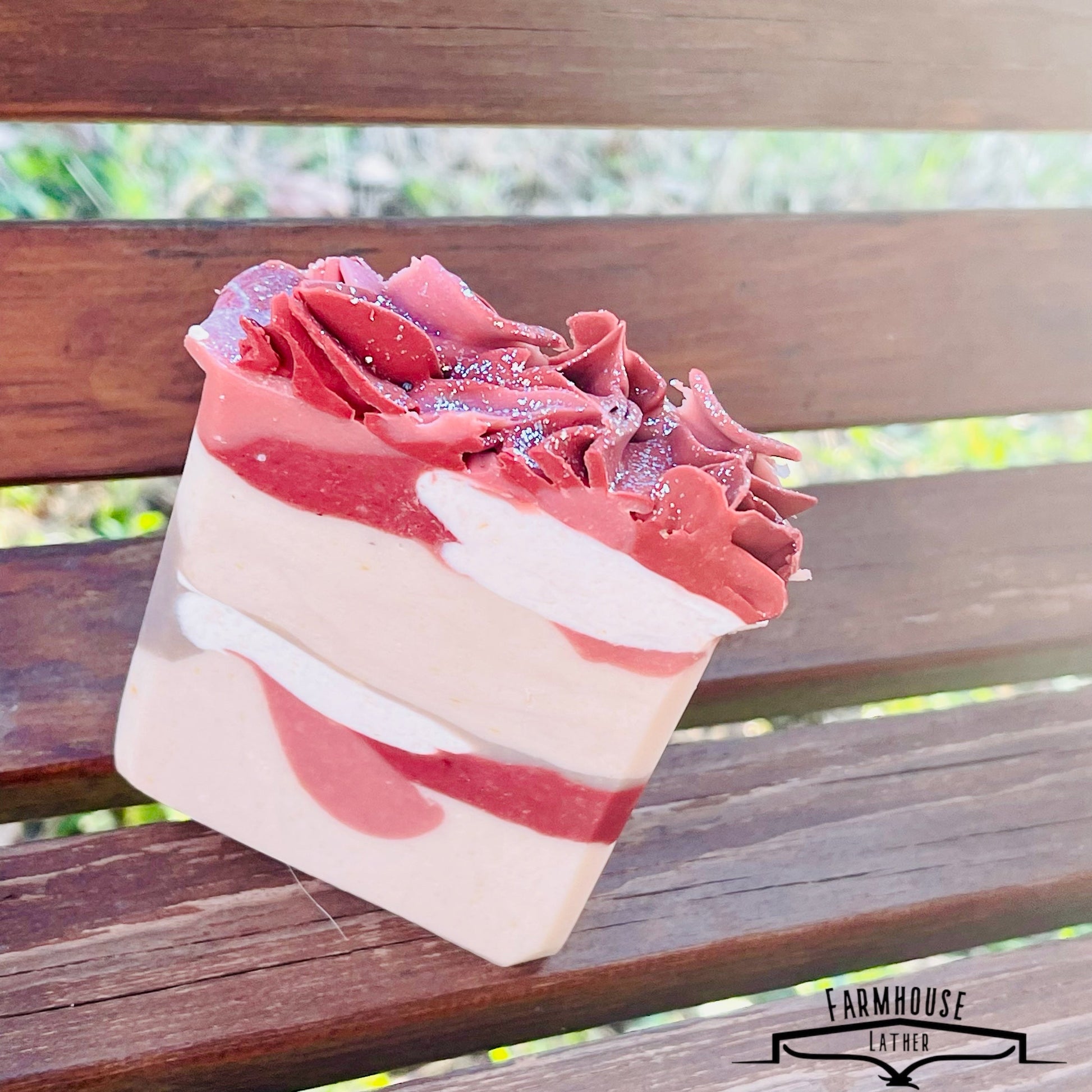 Layered soap bar with pink ridged top and white stripe layers