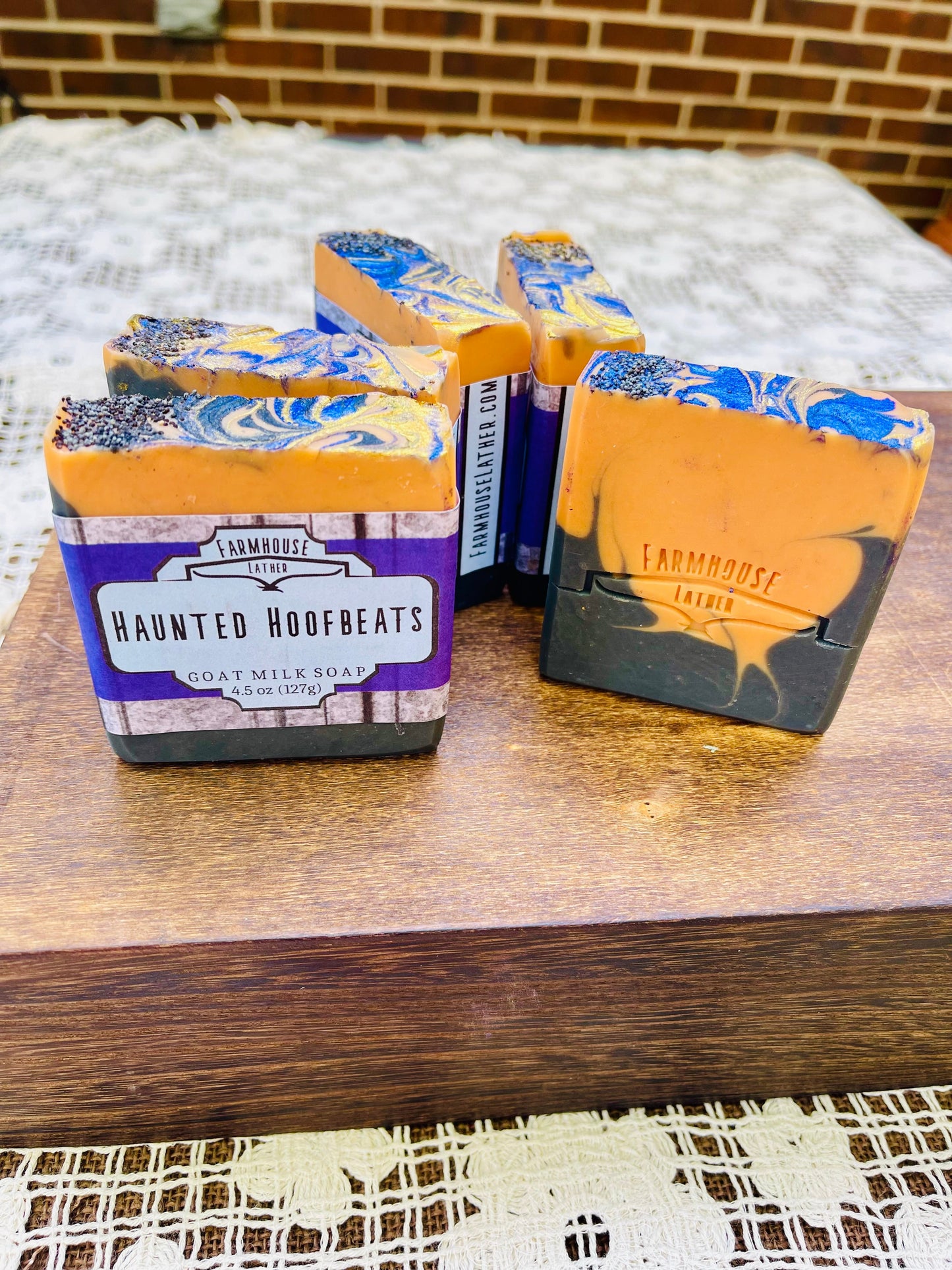 Scented soap bars with tan labels and blue swirl tops