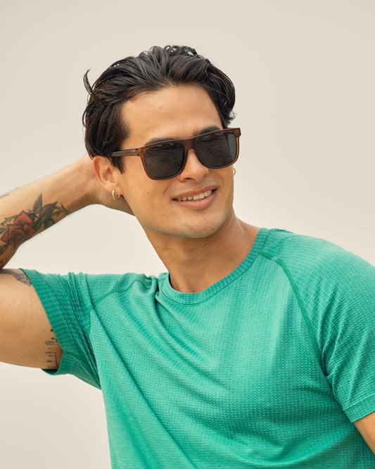 Polarized sunglasses on model, dark lenses and tortoise-style frames