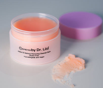 Peach makeup remover cleansing balm jar with open lid and balm scoop