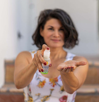 Person holding small hands kit bottle and rubbing onto palms