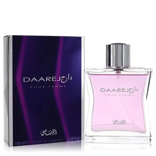 Women’s perfume bottle: square glass, pink liquid, silver cap, beside matching box (100 ml)