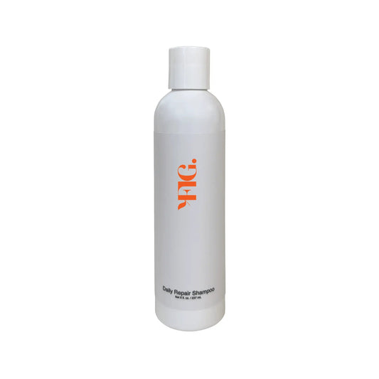 Shampoo bottle with white flip-top cap and orange logo, Daily Repair Shampoo label