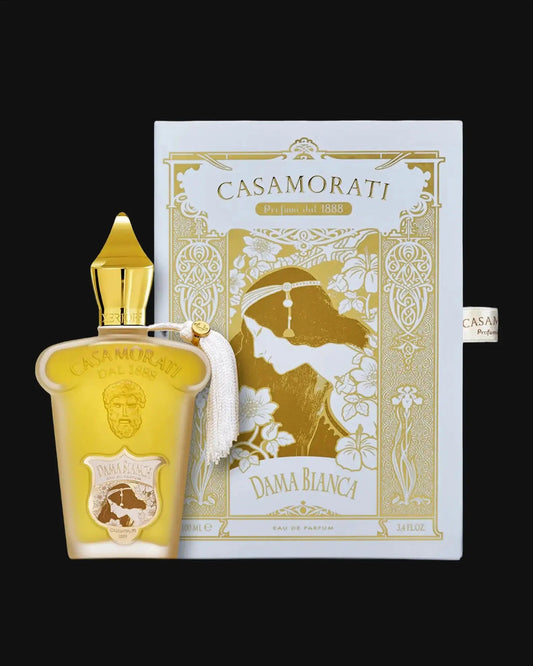 Gold perfume bottle with tassel and matching gold decorative box