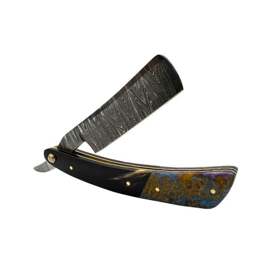Damascus straight razor with black handle, gold accents, and blue inlay strip